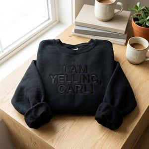 May include: A set of three ceramic mugs with a speckled, matte finish. Each mug is a different colour: light blue, cream, and grey. The mugs have a simple, modern design and a comfortable handle.