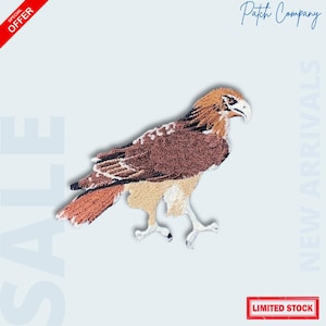 May include: Embroidered patch featuring a detailed hawk design in shades of brown, tan, and white. The patch has a textured appearance and is set against a light blue background. The words "Patch Company", "Sale", "New Arrivals", and "Limited Stock" are also visible.