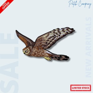 May include: Embroidered patch of a flying owl with outstretched wings. The owl features brown, tan, and black details. The patch has the text "Patch Company", "SALE", "NEW ARRIVALS", and "LIMITED STOCK".