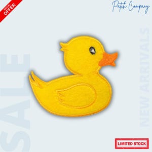 May include: A yellow duck patch with an orange beak and a black eye. The patch is embroidered with a gold outline. The image includes the text "SALE", "NEW ARRIVALS", "LIMITED STOCK", and "Patch Company".