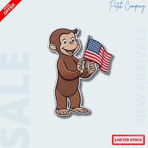 May include: Embroidered patch featuring a brown monkey holding a small American flag. The monkey is smiling, and the flag has red and white stripes with a blue field of stars. The patch has a white border and the text "Patch Company".