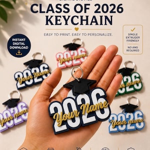 May include: A selection of graduation keychains, each with the year "2026" in white and navy blue, and "Your Name" in gold script. The keychains are topped with a small black graduation cap. The text "CLASS OF 2026 KEYCHAIN" is visible at the top.