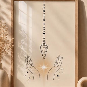 May include: A framed wall art print featuring a black line drawing of two open hands cupped upward, with a glowing light effect between them. A pendulum hangs vertically above the hands, suspended by a chain decorated with small hearts and circles.