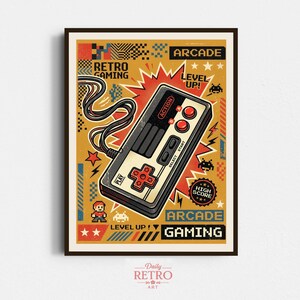 May include: Framed retro gaming art print. The image shows a classic game controller with red buttons and a directional pad. The artwork has a yellow background with the words "Retro Gaming", "Arcade", and "Level Up!" in a vintage style.