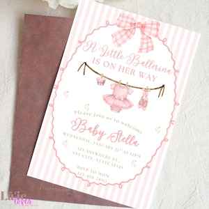 May include: Pink baby shower invitation with a ballerina theme. The invitation features a pink and white striped background, a decorative oval frame, and the text "A Little Ballerina Is On Her Way." It includes a baby tutu, crown, and ballet shoes.