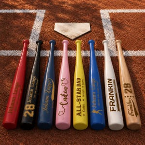 May include: A selection of personalised baseball bats in colours such as red, black, blue, pink, yellow, white, and natural wood. Each bat has custom text, names, and numbers, set against a baseball field background.