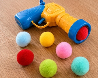 Cat Toy Launcher with Pom Poms + Reusable Bag | Interactive Indoor Cat Toy | Fun Gift for Cats & Cat Lovers
