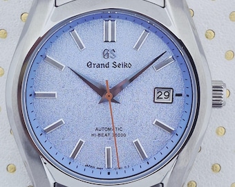 Reloj automático Grand Seiko vintage con esfera texturizada, caja de acero inoxidable y fecha para hombre.