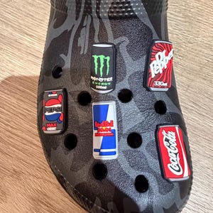 May include: A set of three ceramic nesting bowls in shades of blue, green, and white. The bowls have a speckled glaze and a simple, modern design. The largest bowl is about 15 cm in diameter.