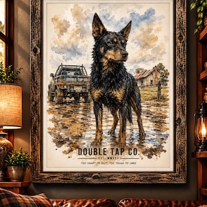 May include: A framed watercolor-style print featuring a black and tan dog standing in a muddy field. In the background, a pickup truck with the text DOUBLE TAP CO. and a rustic house are visible. The text DOUBLE TAP CO. EST. MMXXV TOO SMART TO QUIT, TOO TOUGH TO CARE is printed at the bottom.