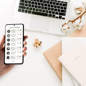 May include: A smartphone displaying a list of trusted vendors with their contact information. The list includes categories such as handyman, contractor, plumber, electrician, painter, HVAC, and roofing.
