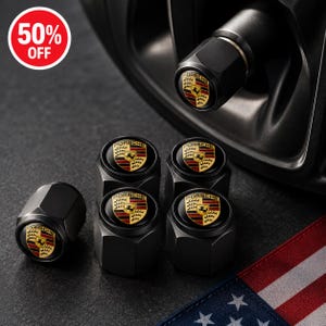 May include: A set of five black metal tire valve caps, each featuring the Porsche logo in red, black, and yellow. One cap is installed on a wheel valve stem, while four are arranged nearby. A red circular graphic displays the text 50% OFF.