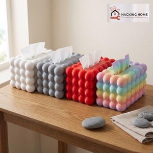 May include: Four rectangular tissue box covers with a bubble-textured surface in white, gray, red, and a rainbow gradient. Each box features a top opening for tissues. The logo HACKING HOME 3D Printed Design for Modern Living is visible.