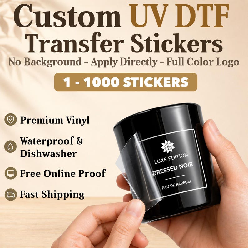 May include: The image showcases a black perfume bottle with a white label, featuring the text "LUXE EDITION DRESSED NOIR EAU DE PARFUM." The image also displays the text "Custom UV DTF Transfer Stickers" and highlights features like premium vinyl and waterproof qualities.