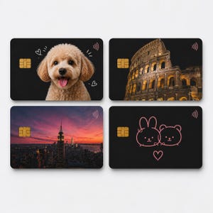 May include: Four black credit cards with distinct designs. One card shows a smiling dog, another the Colosseum, a third the New York City skyline at sunset, and the last a pink cartoon bear and bunny.