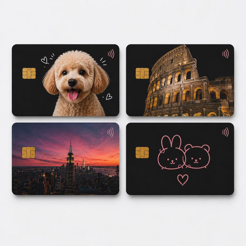 May include: Four black credit cards with distinct designs. One card shows a smiling dog, another the Colosseum, a third the New York City skyline at sunset, and the last a pink cartoon bear and bunny.