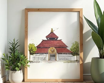May include: Watercolor painting of a building with a red roof and a gold-colored entrance, framed in a light wood frame. The artwork is displayed on a wooden floor, with potted plants on either side.