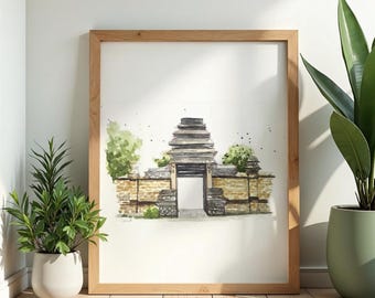 May include: Watercolor painting of a temple with a tiered roof and arched entrance, framed in light wood. The artwork features muted tones of beige, gray, and green, with small trees and foliage. The artwork is displayed on a wooden floor.
