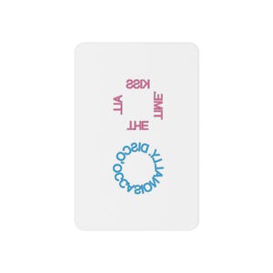 May include: A white rectangular card with rounded corners. The card features the text "Kiss the Lime" in pink and "Yatta Disco" in blue. The text is arranged in a square and a circle.