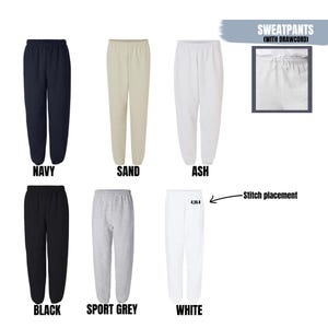 May include: A collection of sweatpants in various colors: navy, sand, ash, black, sport grey, and white. The image includes a close-up of the waistband with a drawstring and the text "SWEATPANTS (WITH DRAWCORD)".