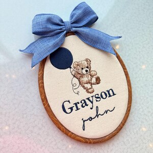May include: A handmade wooden sign with the text "Welcome" in a playful font. The sign features a distressed white background and a dark brown border, perfect for a front door or entryway.