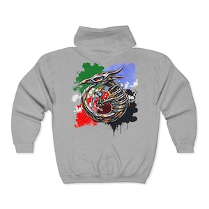 May include: A light gray zip-up hoodie featuring a colorful dragon design. The dragon is metallic with red, gold, and silver accents, surrounded by green, blue, red, and black paint splatters. The hoodie has a hood and a full-length zipper.
