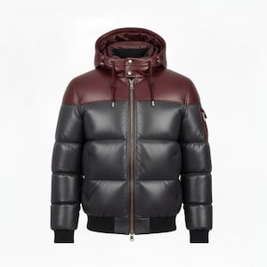 May include: A two-tone puffer jacket with a hood. The top section and hood are a deep burgundy, contrasting with the dark grey body. It has a full-length zip, a black ribbed hem, and cuffs. A fashionable winter coat.