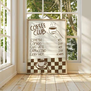 May include: A framed sign with the words "Coffee Club" in brown lettering. The sign lists coffee drinks like espresso and cappuccino, with "yes," "iced," "hot," and "always" as options. A brown and white checkered pattern is at the bottom.