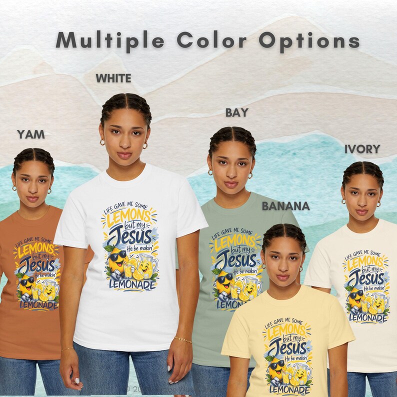 Faith-based lemon graphic showing “Life Gave Me Some Lemons, But My Jesus, He Be Makin’ Lemonade” graphic tee available in white, bay, banana, ivory, and yam colors.