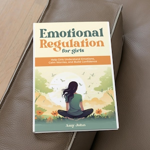 May include: A book titled "Emotional Regulation for girls" with a cover illustration of a person meditating in a field. The book's subtitle reads "Help Girls Understand Emotions, Calm Worries, and Build Confidence." The author's name is Amy John.