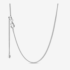 May include: A silver-colored necklace with a delicate chain design. The necklace features an adjustable length with a lobster clasp closure and a small, round charm at the end of the adjustable chain. The necklace is displayed against a plain white background.