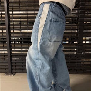Splicing Wide Leg Jeans | Washed Loose Denim Pants | Retro Y2K Streetwear Style 

Splicing wide leg jeans with a retro washed design and loose fit silhouette, styled for streetwear outfits and casual everyday wear with a modern relaxed look.