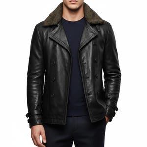 May include: A black leather jacket with a double-breasted design and a dark green fur collar. The jacket features multiple buttons and a tailored fit. The sleeves have adjustable cuffs. The jacket is a classic outerwear piece.
