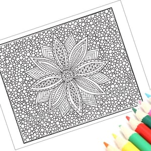 May include: Black and white mandala coloring page with a detailed floral design and a background of small circles. A set of colored pencils in various colors are in the lower right corner, ready for use.