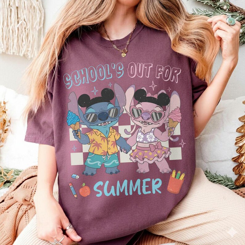May include: Burgundy t-shirt with a cartoon graphic of two characters holding ice cream cones, wearing sunglasses, and the text "SCHOOL'S OUT FOR SUMMER". The characters are set against a checkered background.