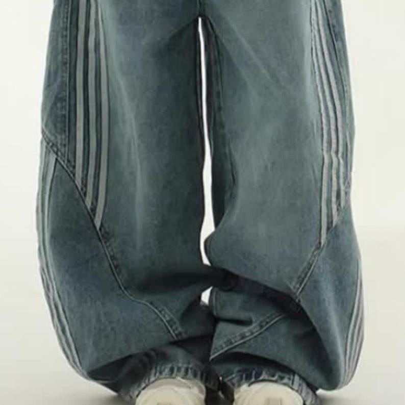 Baggy Wide Leg Jeans | Retro Oversized Pants | Spliced Denim Trousers | Alternative Y2K Grunge Streetwear
.
Women's oversized wide-leg denim pants with spliced striped detailing, baggy streetwear jeans in retro Y2K fashion style, perfect for alternative and casual outfits.