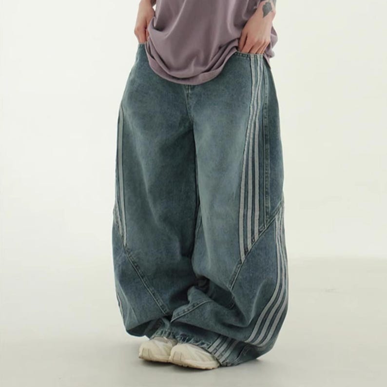 Baggy Wide Leg Jeans | Retro Oversized Pants | Spliced Denim Trousers | Alternative Y2K Grunge Streetwear
.
Women's oversized wide-leg denim pants with spliced striped detailing, baggy streetwear jeans in retro Y2K fashion style, perfect for alternative and casual outfits.