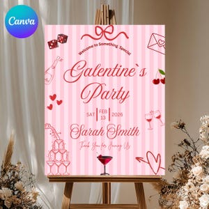 May include: A pink and white striped Galentine's Party sign on an easel. The sign includes the text "Galentine's Party" and "Sarah Smith", along with illustrations of dice, champagne, hearts, and cocktails.