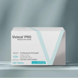 May include: A white box of Viviscal PRO, a dietary supplement for advanced hair health. The box features the brand name, product details, and the text "180 Tablets." The box also states it is a "Professional Strength" formula.