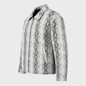 May include: A long-sleeve jacket featuring a grey and white snakeskin pattern. The garment includes a standard collar, a front button placket, and two side pockets. The design displays a consistent reptilian scale print across the entire exterior surface of the jacket, providing a uniform look from the collar down to the hem.