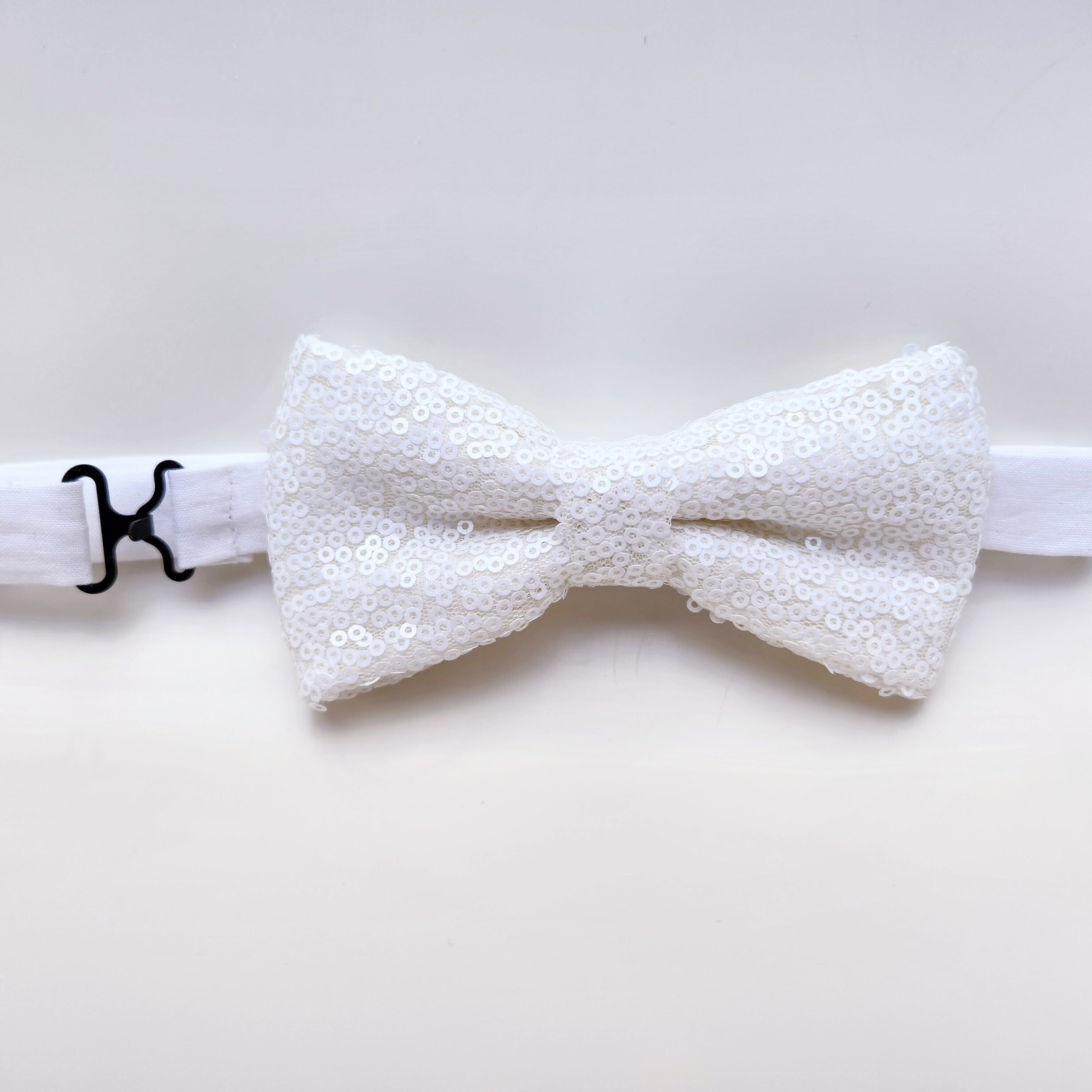 white sequin bow tie