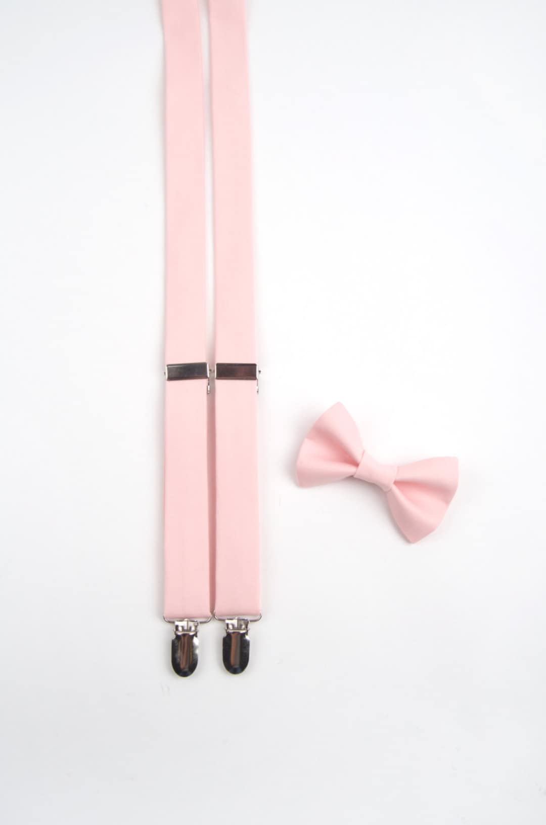 blush pink bow tie and suspenders