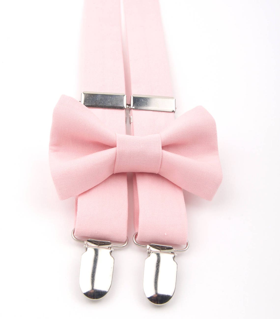 pale pink bow tie and suspenders