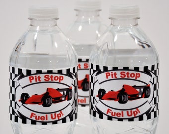 May include: Three clear plastic water bottles with black and white checkered labels. The labels feature a red race car with the text "Pit Stop Fuel Up!"