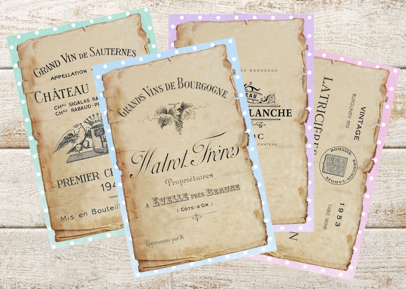 May include: Four vintage-style wine label prints with distressed edges and polka dot borders in shades of blue, green, and pink. The labels feature French text and illustrations, including a grape vine and a coat of arms.