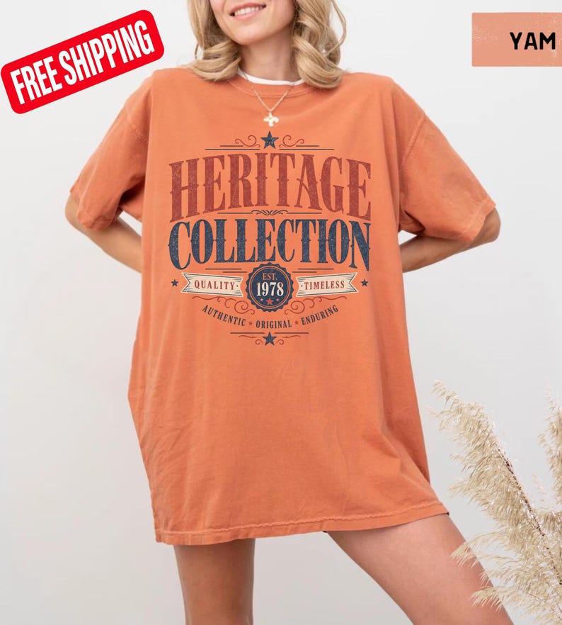 May include: An orange t-shirt featuring the text "HERITAGE COLLECTION" in a retro design. The shirt includes the year "1978" and the words "Quality, Timeless, Authentic, Original, Enduring". The t-shirt is a solid colour.