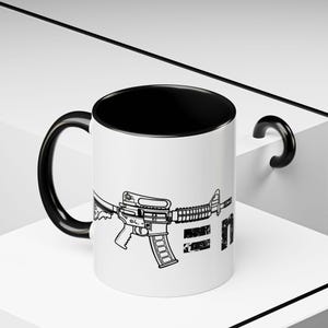 AR rifle coffee mug, a coffee mug that speaks your mind. You always need one more gun equation. AR Rifle coffee cup.