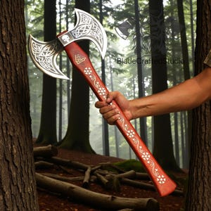 May include: A double-bladed axe with a red wooden handle and silver blades. The blades feature intricate Celtic knotwork and a skull design. The handle is decorated with white floral patterns and a triangular symbol.