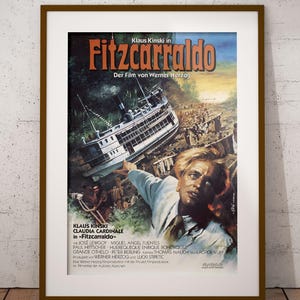 May include: A set of three ceramic mugs with a speckled, matte finish. The mugs are in shades of cream, light gray, and dark gray. Each mug has a simple, minimalist design and a rounded handle.