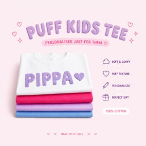 May include: A stack of four folded t-shirts in white, pink, lavender, and blue. The top white shirt has the name "PIPPA" in puffy purple letters with a heart. The text "PUFF KIDS TEE" and "PERSONALISED JUST FOR THEM" are above the shirts.